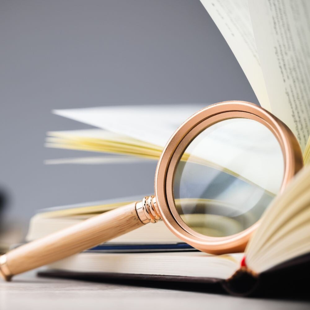 Magnifying glass on a dictionary