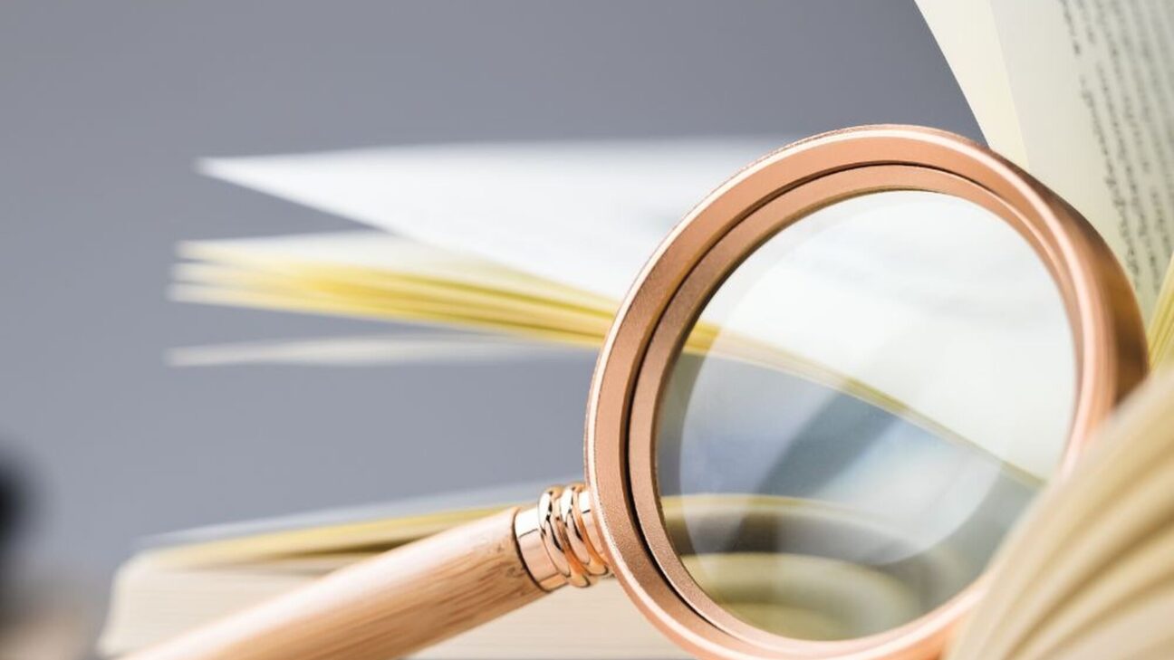 Magnifying glass on a dictionary