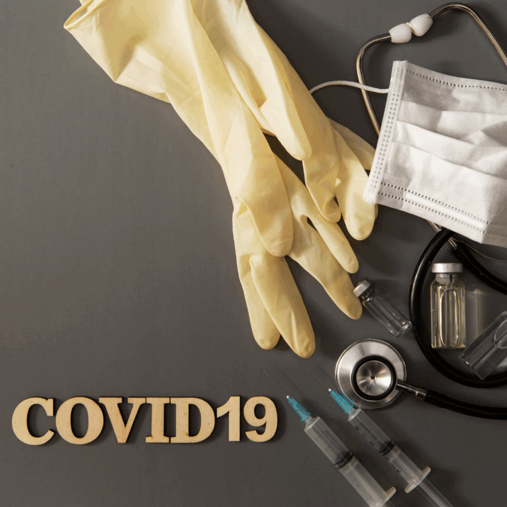 The words COVID-19 and a mask, stethoscope, and gloves.