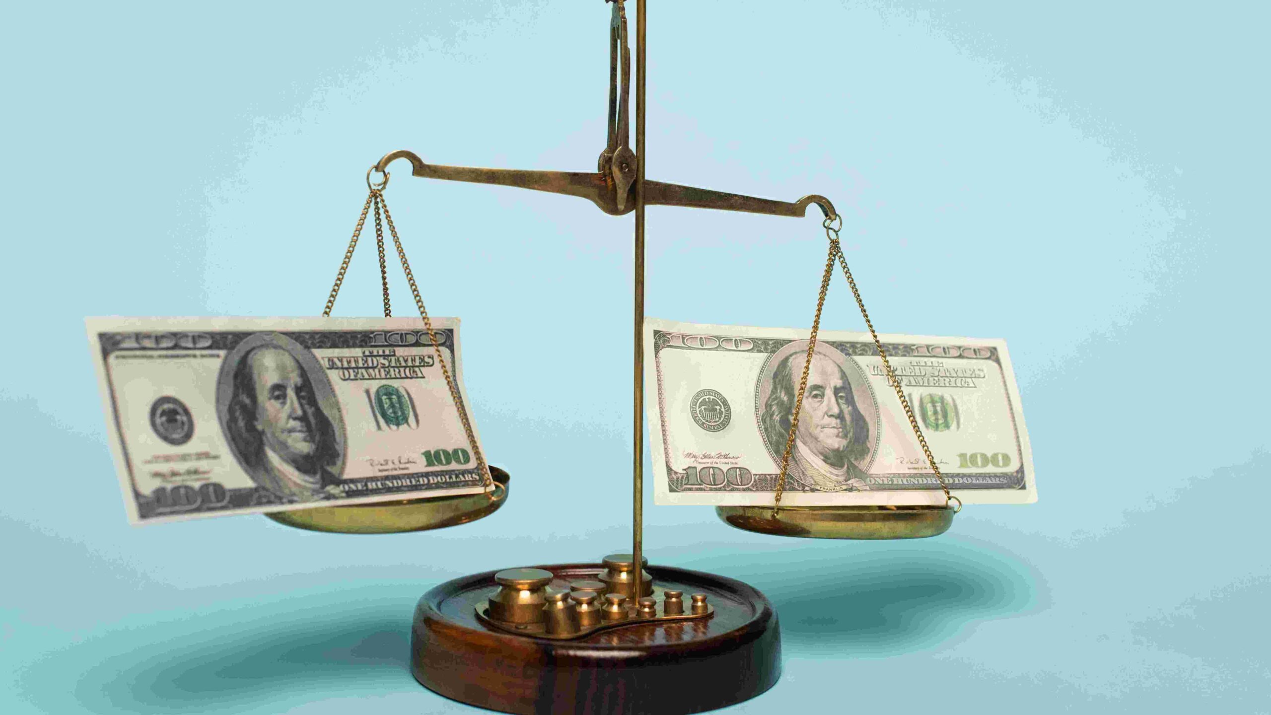 Scales money on both scales